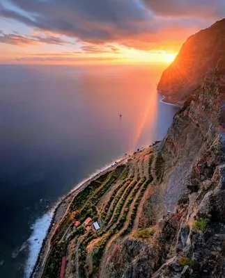 an aerial view of a mountain with a rainbow at Casa Jardim in Ponta do Pargo