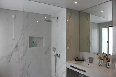 a bathroom with a shower and a sink and a mirror at Vicente´s LOB ( Lobos Ocean Breeze) in Câmara de Lobos