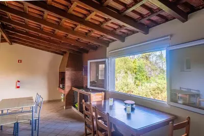 a dining room with a table and a large window at Santana House Holiday Rental - For Nature Lovers by YOUR KEY in Santana
