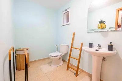 a bathroom with a toilet and a sink at Santana House Holiday Rental - For Nature Lovers by YOUR KEY in Santana