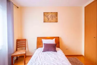 a bedroom with a bed and a picture on the wall at Santana House Holiday Rental - For Nature Lovers by YOUR KEY in Santana