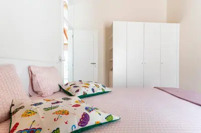 a bedroom with a bed with two pillows on it at Casa Hortas in Vila do Bispo