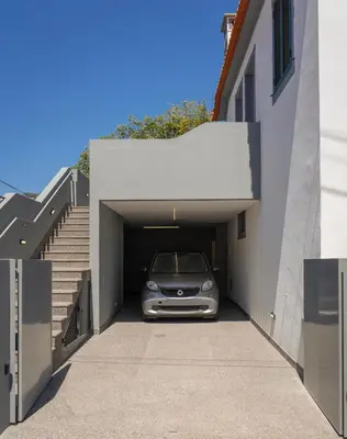 a car is parked inside of a garage at Achada Sol in Funchal