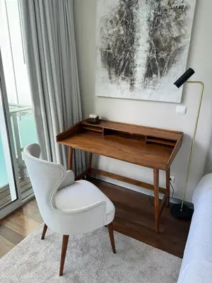 a desk and a chair in a room at Plaza Funchal - Coração da cidade in Funchal