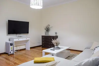 a living room with a couch and a tv at GuestReady - Tranquil Spot in São Vicente in São Vicente