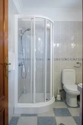 a bathroom with a shower and a toilet at GuestReady - Tranquil Spot in São Vicente in São Vicente