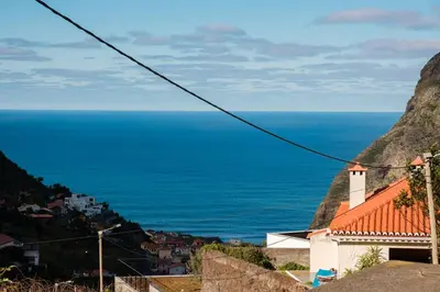 a view of the ocean from a town at GuestReady - Tranquil Spot in São Vicente in São Vicente