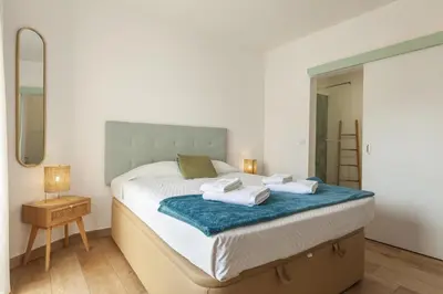 a bedroom with a bed with towels on it at A18 - Luz Studio in Praia da Luz in Luz
