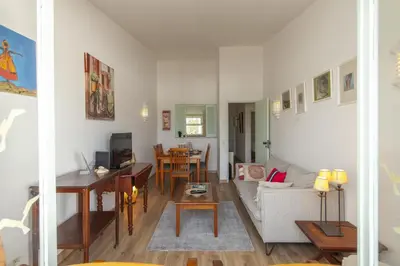 a living room with a couch and a table at B86 - Beachline Apartment in Praia da Luz in Luz