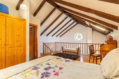 a bedroom with a large bed in a room at Villa Tabua in Ribeira Brava