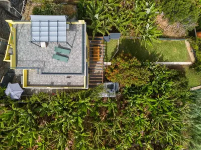 an overhead view of a house with a solar array on the roof at Sky & Ocean in Calheta