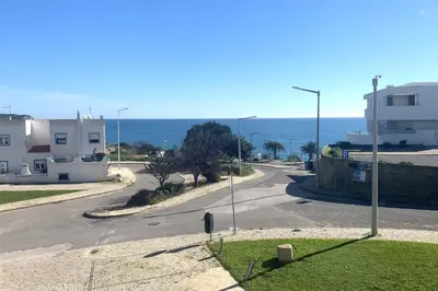 an empty street with buildings and a street light at Casa do Mar in Salema