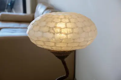 a lamp with a ball on a table at GuestReady - A splendid sea-view stay in Caniço