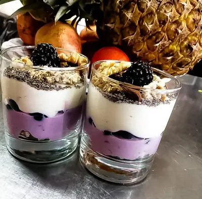 two glasses filled with a dessert on a table at CASA DA HORTA in Aljezur