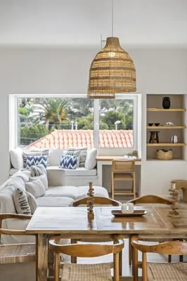 a living room with a couch and a table at Casa do Cacto - By WeHost in Porto Santo