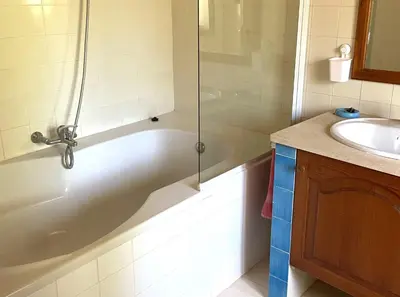 a bathroom with a shower and a tub and a sink at Monte Rosa Rural Guesthouse in Lagos