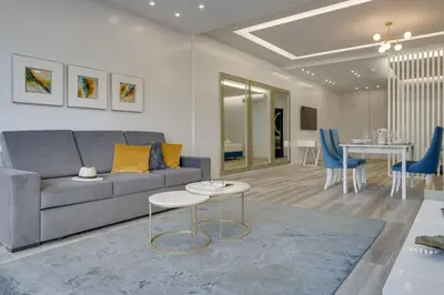 a living room with a couch and a table at Torre Palace I by Atlantic Holiday in Câmara de Lobos