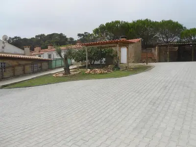 a brick driveway with a pavilion in a yard at Monte Chabouco - Alojamento Local in Chabouco