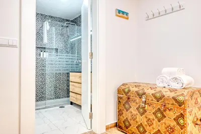 a bathroom with a shower and a tub at Atlantic View, a Home in Madeira in Ponta do Sol
