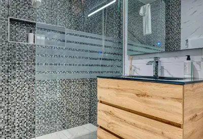 a bathroom with a sink and a shower at Atlantic View, a Home in Madeira in Ponta do Sol