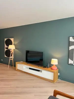 a living room with a flat screen tv on a table at Southern Skies Apartment in Funchal