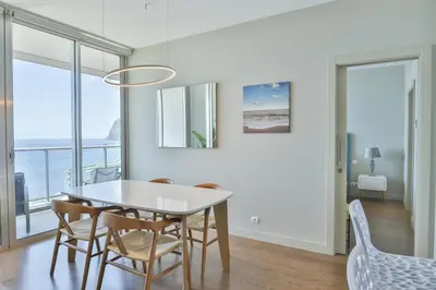 a dining room with a table and chairs at Southern Skies Apartment in Funchal