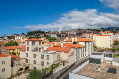 a view of a city with orange roofs at Santa Luzia III by An Island Apart in Funchal