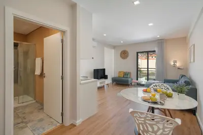a living room with a table and a living room at Santa Luzia III by An Island Apart in Funchal