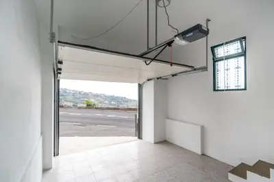 an empty garage with a view of a road at Atouguia House - Traditional House in Calheta