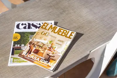 a magazine sitting on top of a table at Casa Epic in Sagres