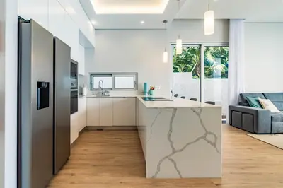 a kitchen with a marble counter top in a room at Villa Anita ,beautiful sunset in Arco da Calheta