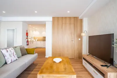 a living room with a couch and a coffee table at Casa Magnólia in Funchal
