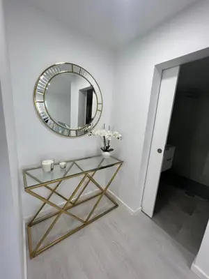 a bedroom with two beds and a large mirror at Funchal Lido Belo Horizonte in Funchal