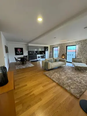 a living room with a couch and a table at Carreira Residence in Funchal