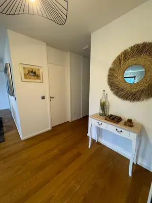 a room with a table and a mirror on the wall at Carreira Residence in Funchal