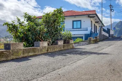 a house on the side of a road at Casa dos Anjos, a Home in Madeira in Faial