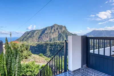 a balcony with a view of a mountain at Casa dos Anjos, a Home in Madeira in Faial