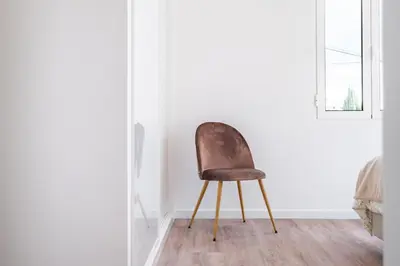 a chair in the corner of a room at Casa Buganvília in Funchal