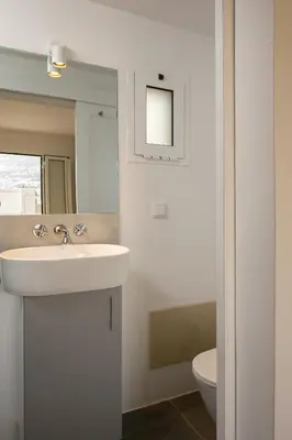 a bathroom with a sink and a toilet at Luna Rossa by Homie in Funchal