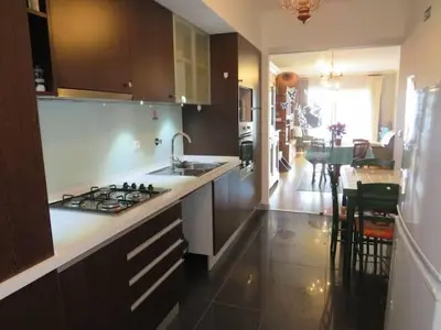 a kitchen with a sink and a stove top oven at GuestReady - Tamariz Cosy Stay in Caniço