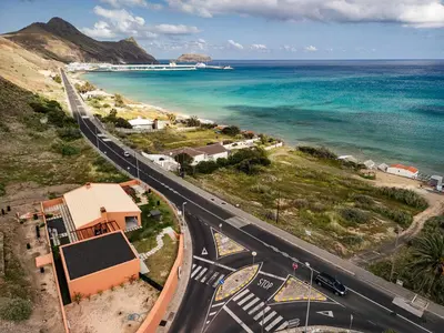 an aerial view of a road next to the ocean at Praia Encantada in Porto Santo