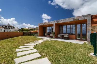 a house with a stone pathway in the yard at Praia Encantada in Porto Santo