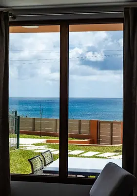 a view of the ocean from a window at Praia Encantada in Porto Santo