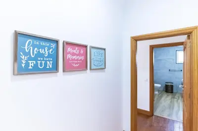 a hallway with four pictures on a wall at Villa Machico Valley in Machico