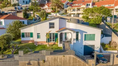 an aerial view of a white house at SUNSET VILLA in Caniço
