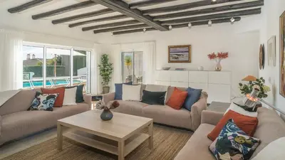a living room with two couches and a table at Casa das Palmeiras, Luxury Villa in Luz