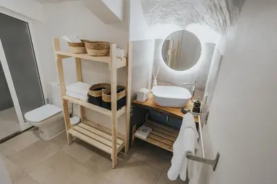a bathroom with a sink and a mirror at Pico Apartment's in Câmara de Lobos
