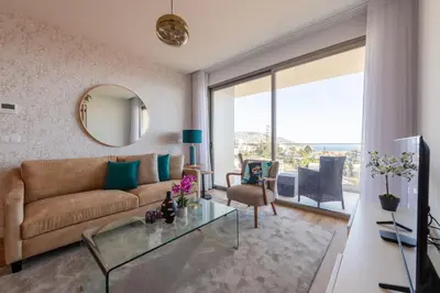 a living room with a couch and a glass table at The King Apartment By Sam Houses in Funchal