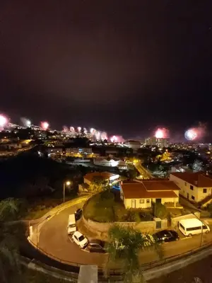 a city at night with cars parked on a road at The King Apartment By Sam Houses in Funchal