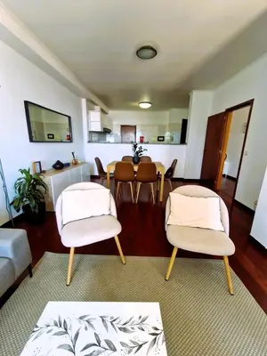 a room with a picture of a woman sitting on a couch at Bay View House by MTH in Funchal